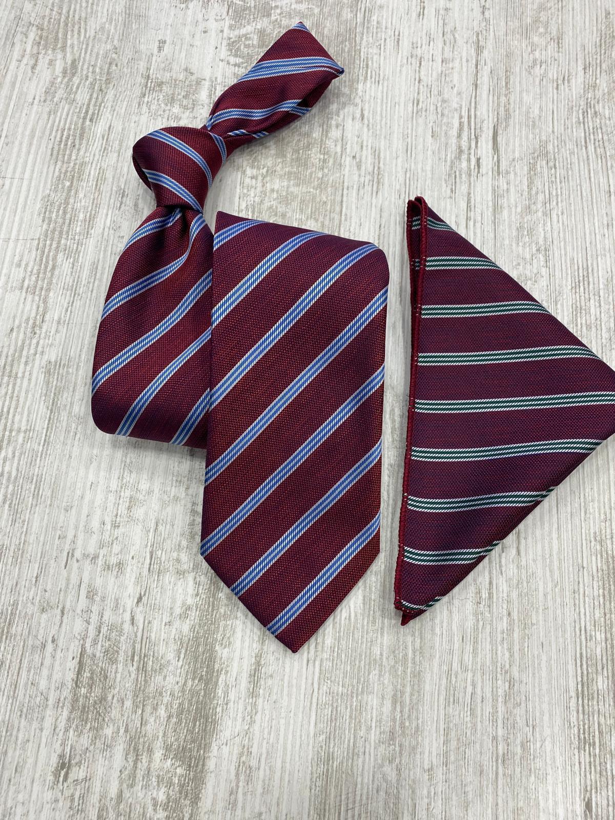 Maroon striped tie and pocket square on a light wooden surface