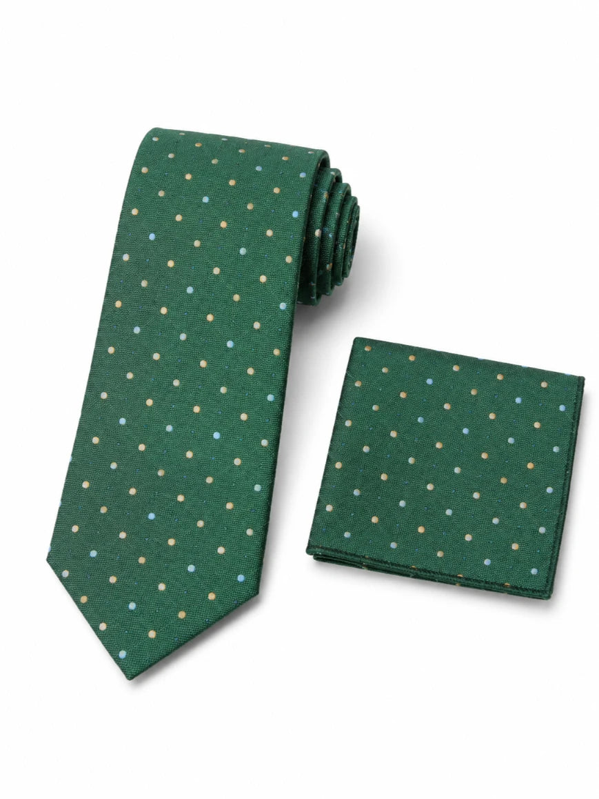 A green necktie and matching pocket square set with a small multicolor polka dot pattern, displayed on a clean white background.
