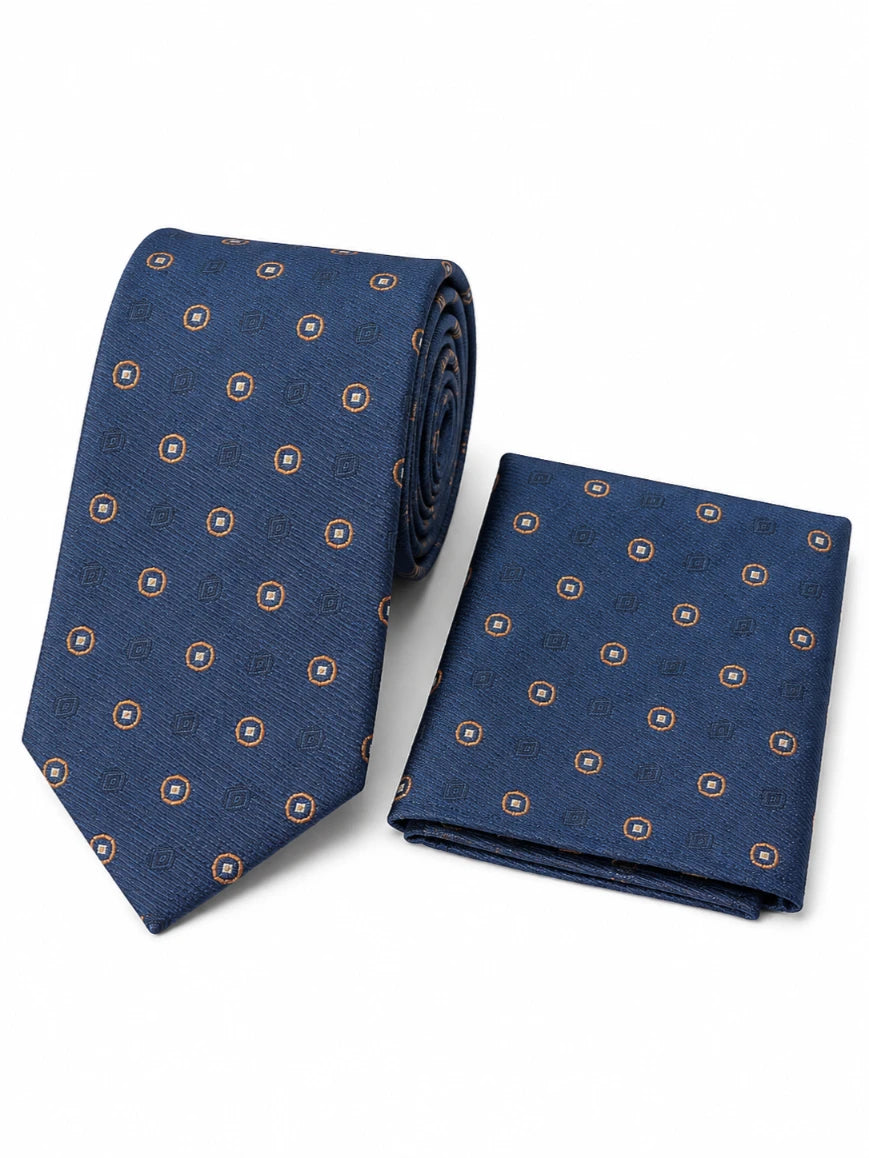 Infynite navy blue gold-ringed circle medallion tie and pocket square set with tonal geometric background motifs laid flat on white background