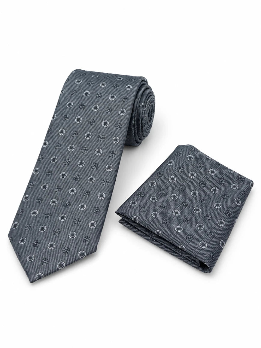 Infynite steel grey tonal circle and square medallion tie and pocket square set with fine diagonal ribbed woven base laid flat on white background