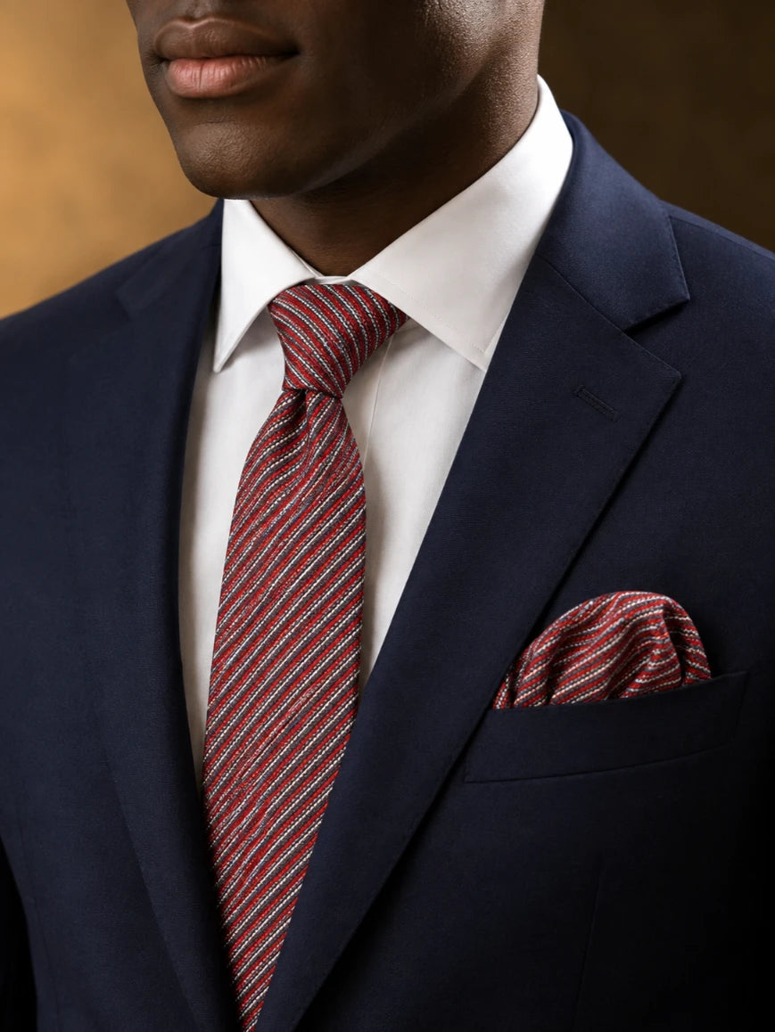 Infynite crimson red and silver-white multi micro-stripe tie and pocket square set styled with a navy suit and white dress shirt