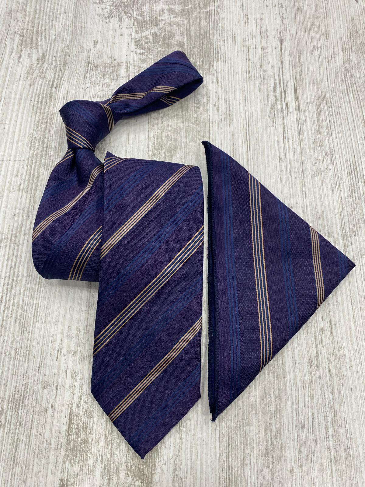 Navy striped tie and pocket square on a light wooden surface
