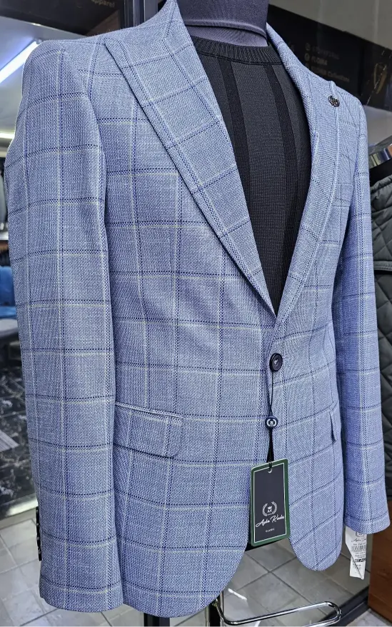 Blue checkered suit jacket on a mannequin with a blurred background