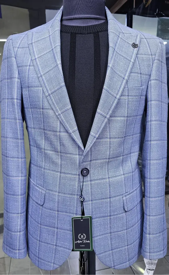 Blue checkered suit jacket on a mannequin with a visible brand tag.