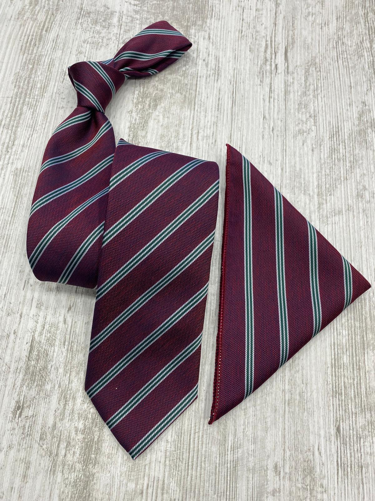 Maroon striped tie and matching pocket square on a light wooden surface