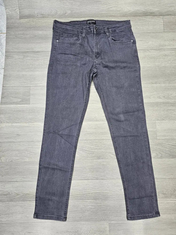 Pair of gray jeans on a wooden floor