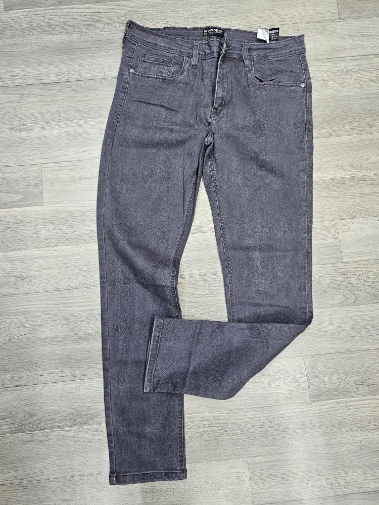 Pair of gray jeans on a wooden floor