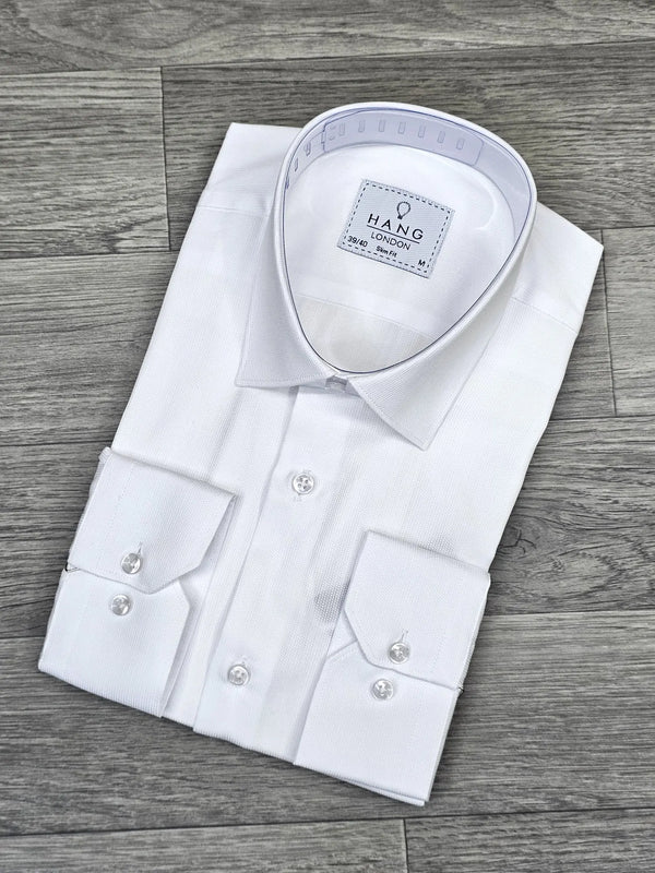 White dress shirt with collar on a wooden surface