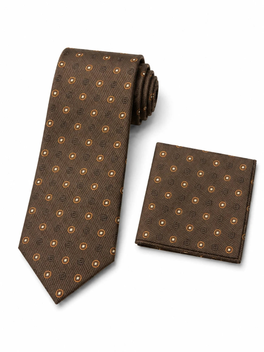 Infynite chocolate brown geometric medallion tie and pocket square set styled with a navy suit and white dress shirt