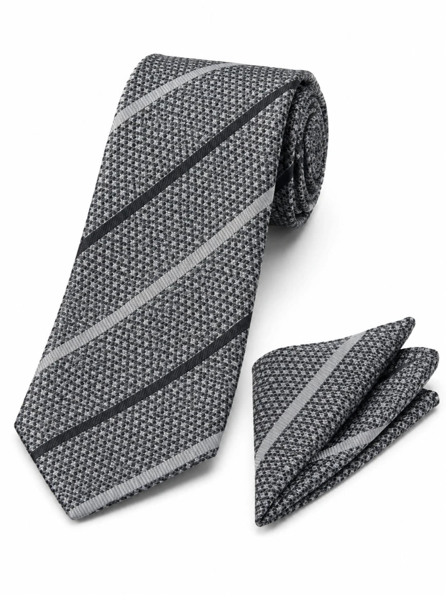 Infynite charcoal grey diagonal regimental stripe tie and pocket square set with black and silver stripes on textured micro-dot base laid flat on white background