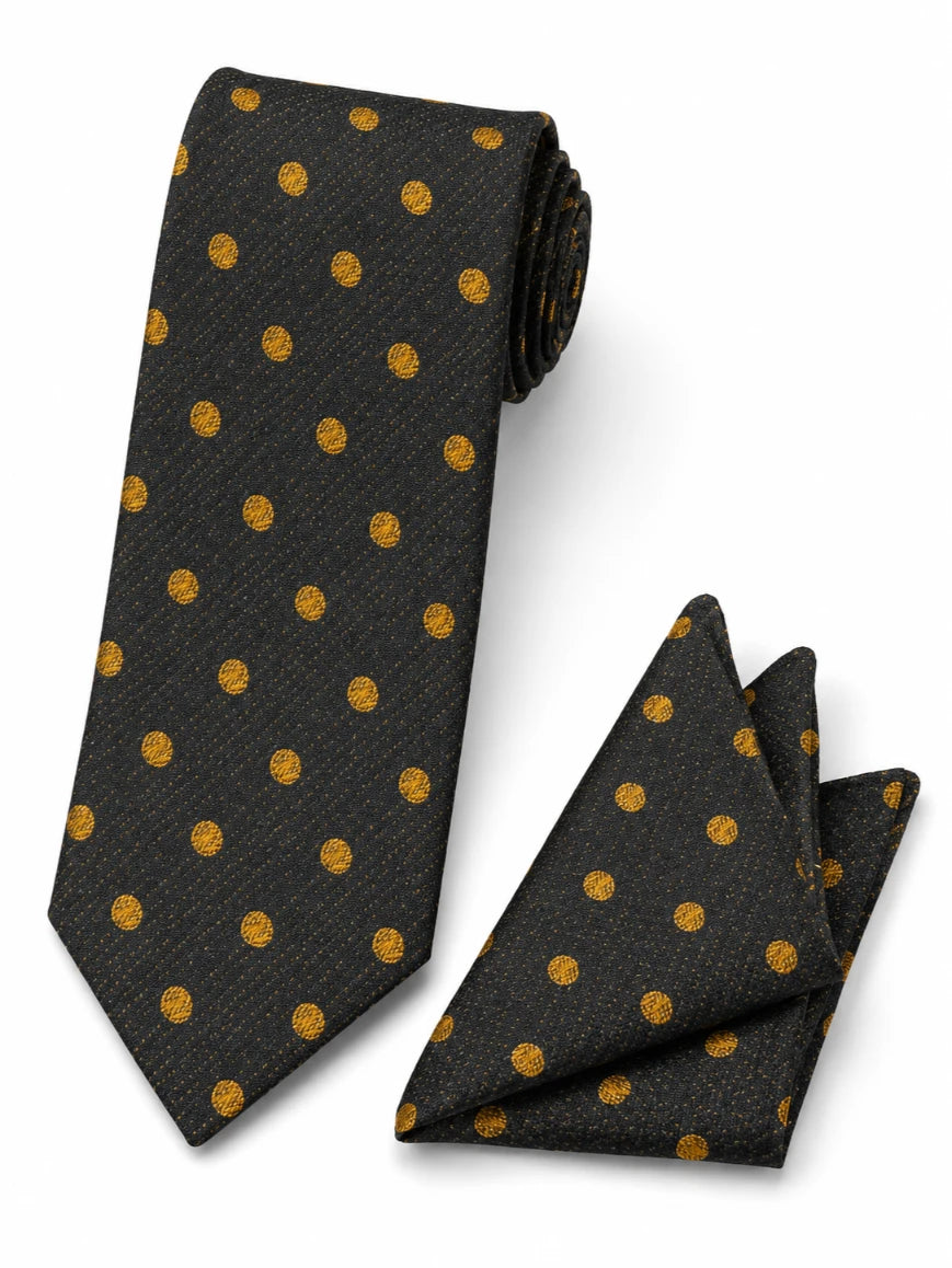 Infynite midnight black and gold polka dot tie and pocket square set with large woven gold dots on textured black base laid flat on white background