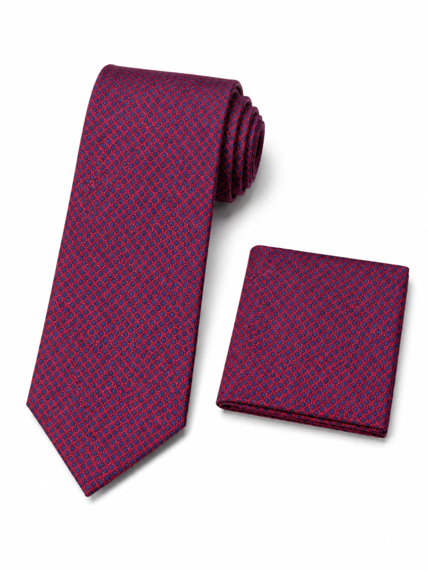 Infynite magenta and navy micro geometric lattice tie and pocket square set with dense woven pattern laid flat on white background