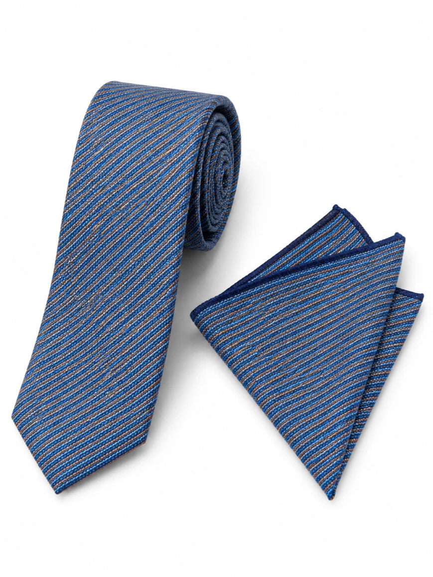Infynite denim blue multi-colour micro diagonal stripe tie and pocket square set with amber rust and green flecks on woven textured base laid flat on white background