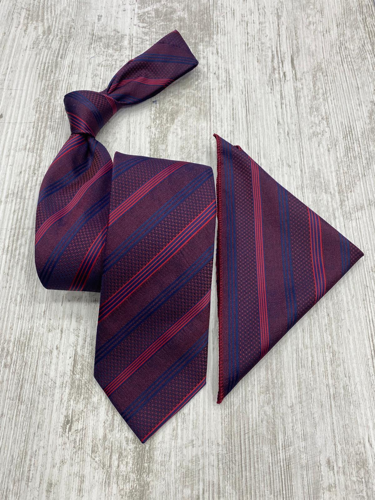 Burgundy and blue striped tie and pocket square on a light wooden surface