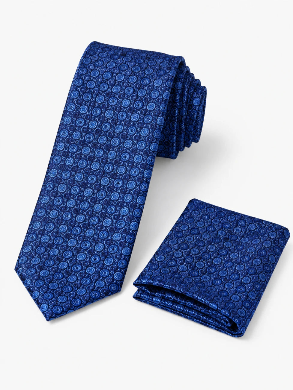 Blue patterned tie and matching pocket square on a white background