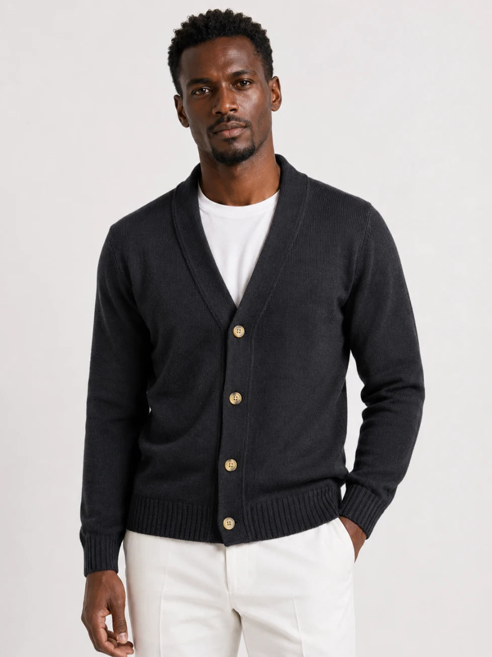 African man wearing an Infynite charcoal shawl-collar button cardigan for smart casual menswear styling.