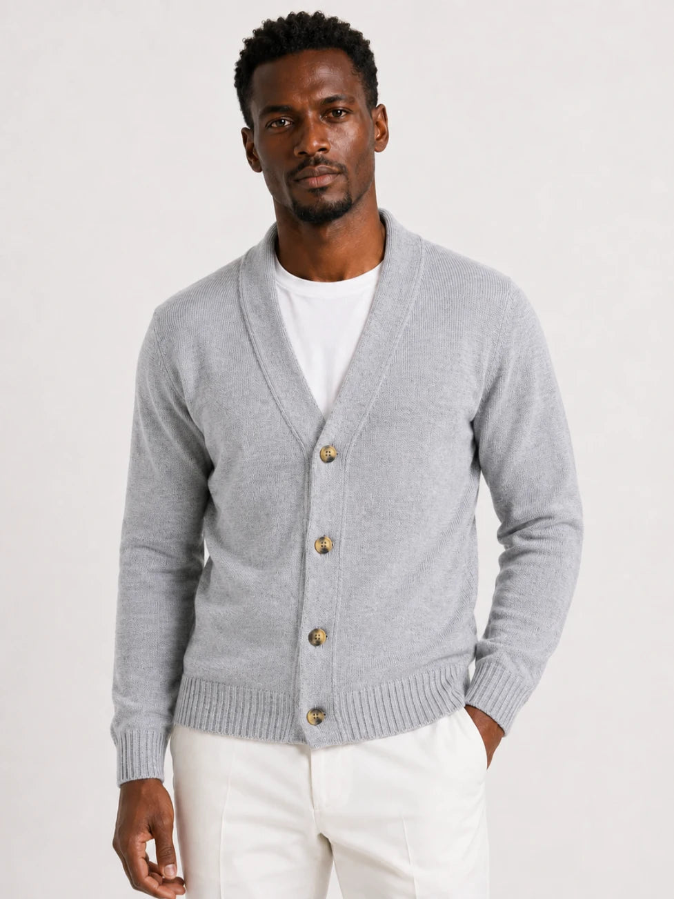 African man wearing an Infynite light grey shawl-collar button cardigan for refined smart casual menswear.